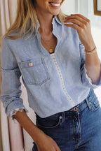 Beau Blue Lace Trim denim blouse with dotted print, lace trim, collared split neck, 3/4 sleeves, and patched pocket.