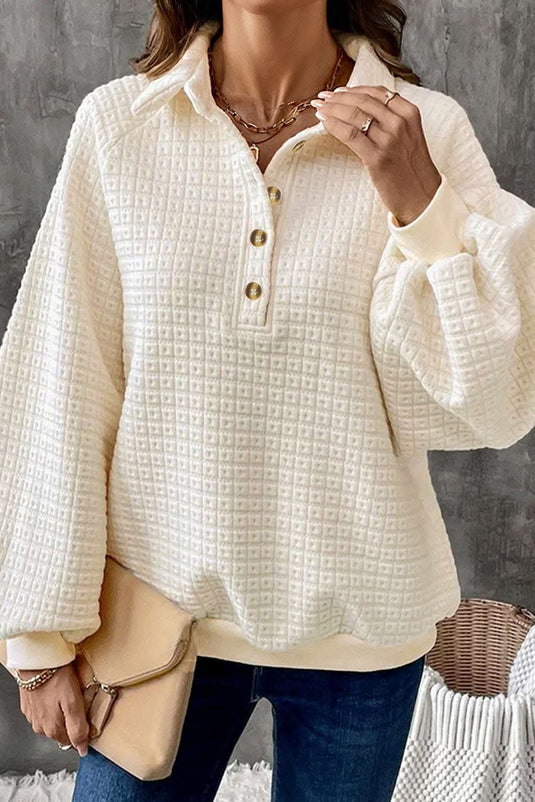 Beige pineapple textured half button collared sweatshirt with puff sleeves and soft breathable fabric.