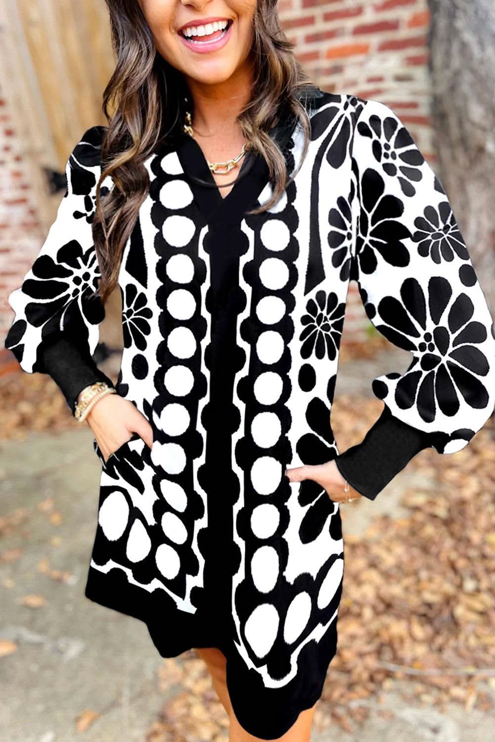 Black polka dot floral printed V neck long sleeve shift mini dress in black and white