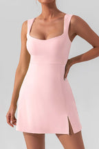 Light pink sleeveless mini dress with U neck and side slit