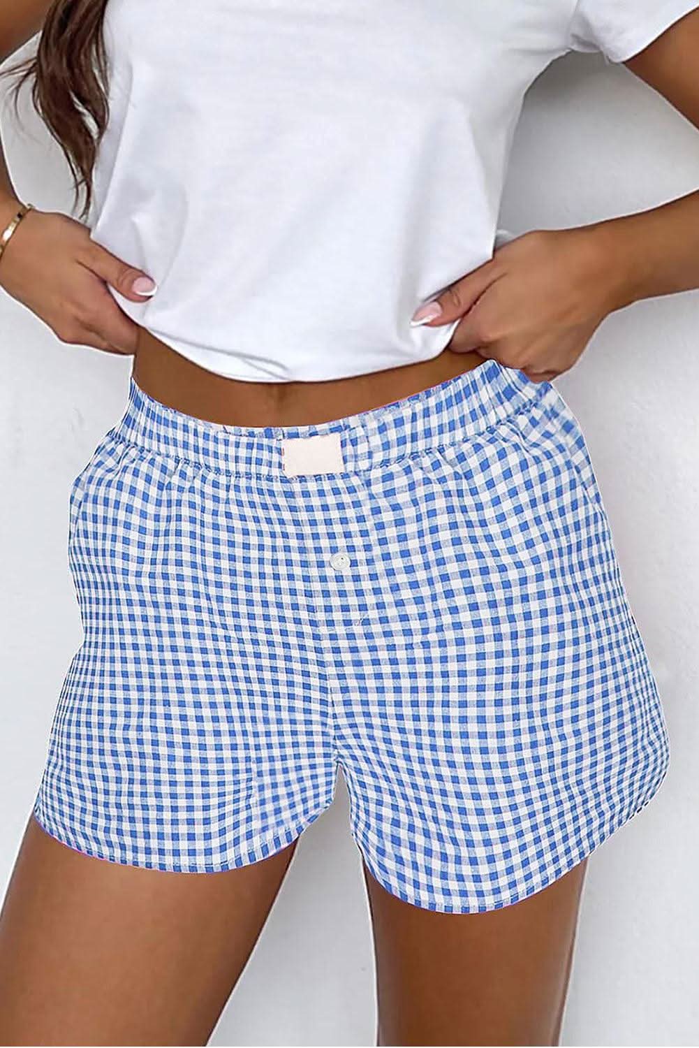Women's high waist gingham shorts in blue and white with elastic waistband and button fly.