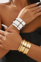 Gold minimalist multi-layered opening alloy bangle on wrist