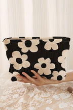 Black flower printed rib textured cosmetic bag with zipper closure and compact travel size