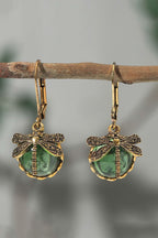 Grass green vintage dragonfly crystal pendant earrings hanging on branch