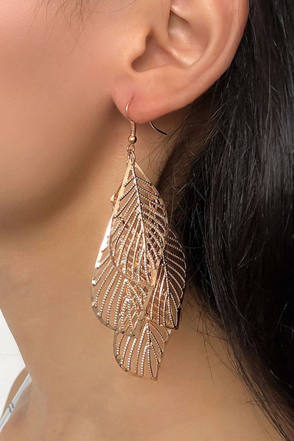 Gold hollow out leaves plated alloy hook earrings worn on ear