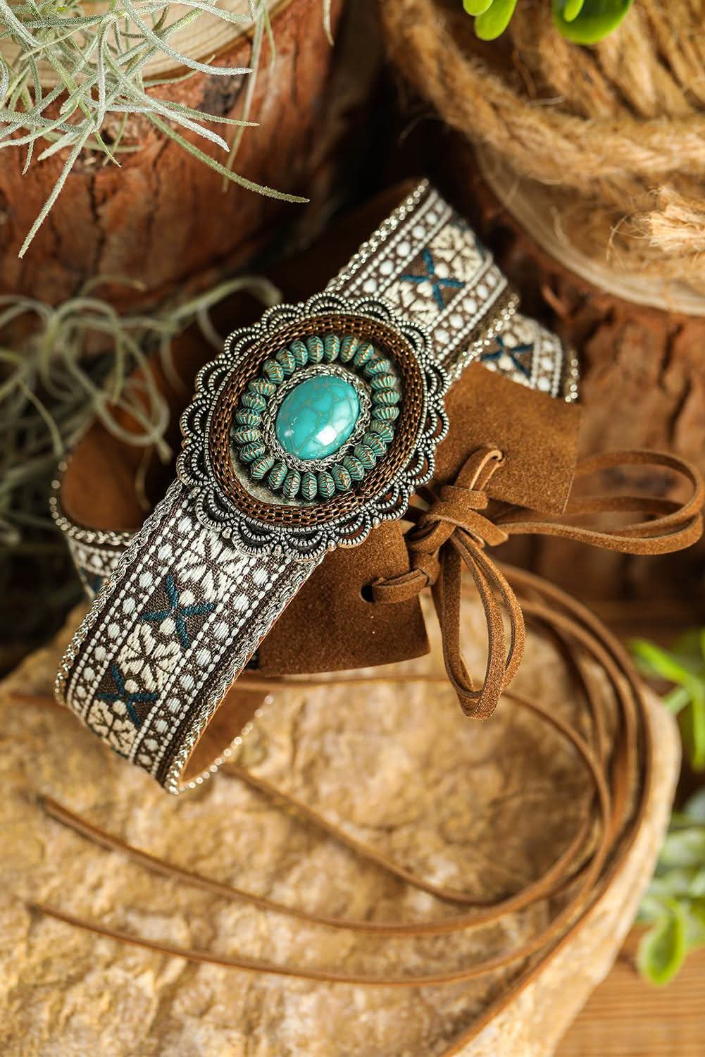 Light blue western pattern turquoise decorated lace-up PU leather hat band on wooden background