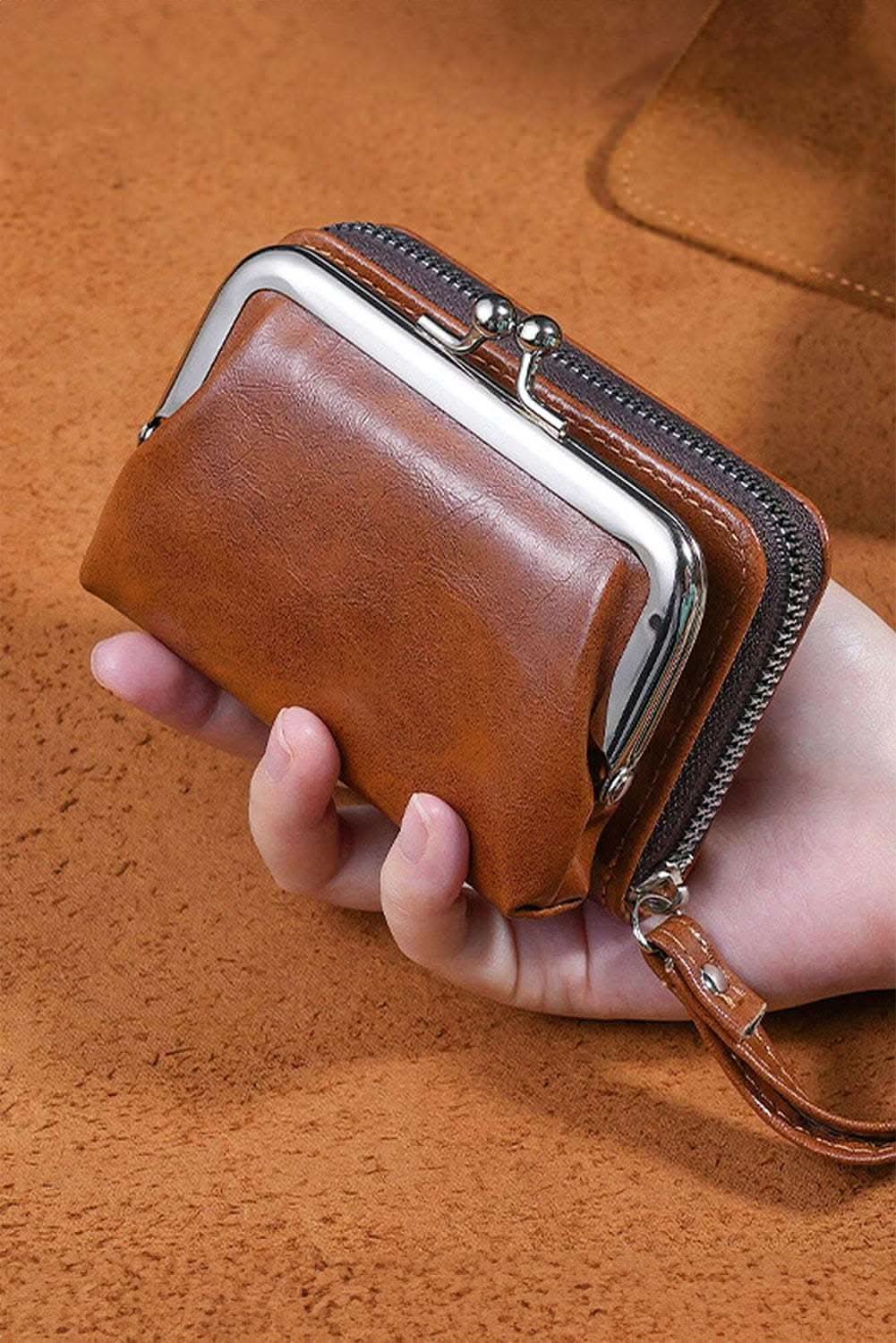 Chestnut minimalist wristlet PU leather coin purse with metal clasp and zipper compartments.