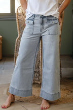 Sky blue stripe wide leg jeans with button flap pockets and cuffed hem in light wash denim