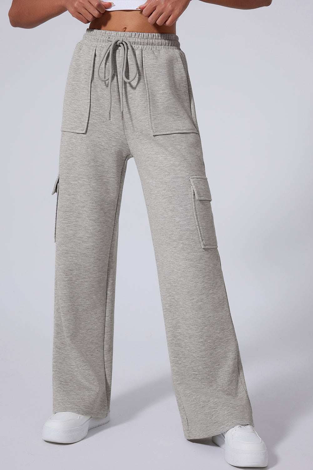Light grey high waist wide leg workout pants with multi pockets and lace-up detail