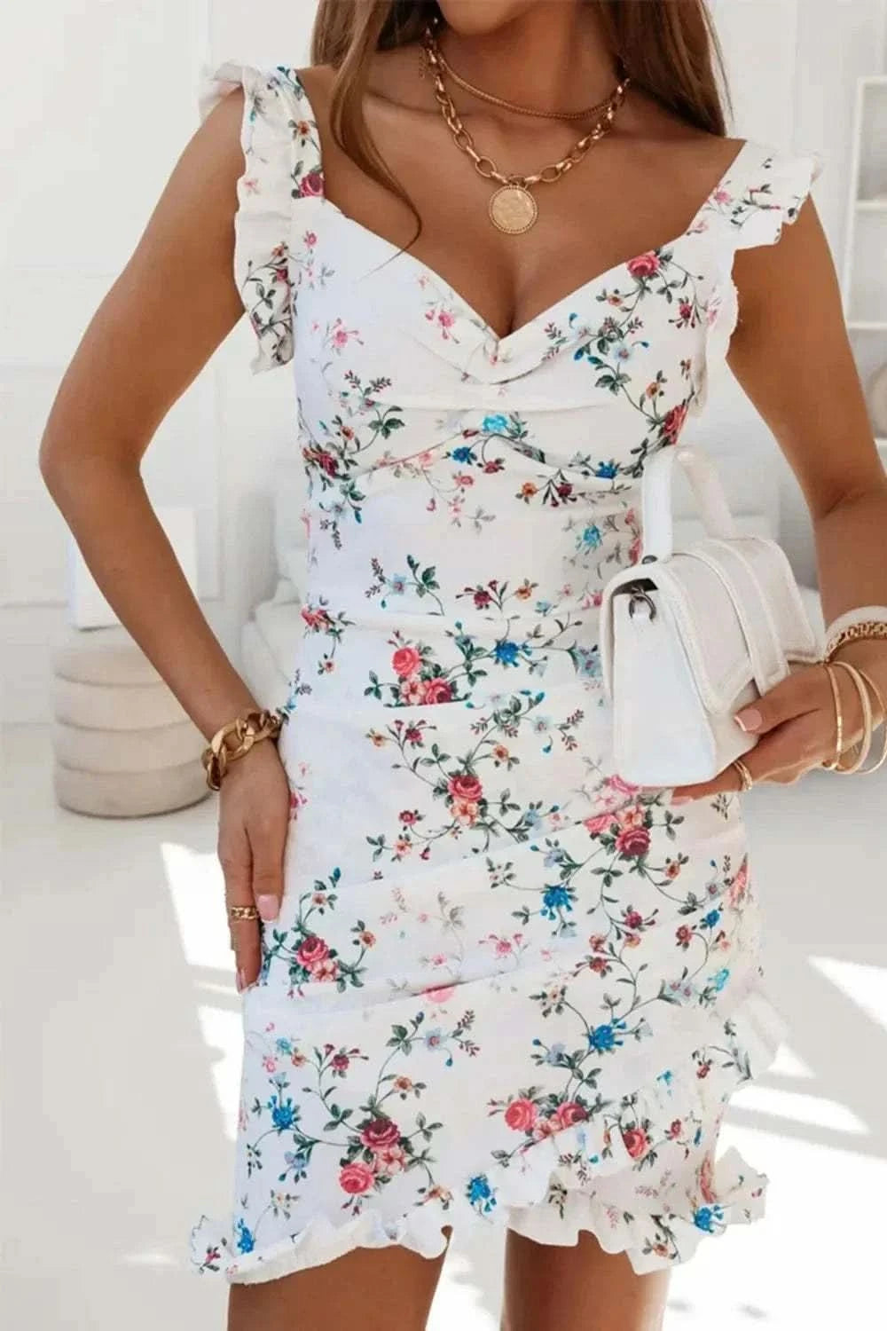 Printed ruffled sweetheart neck mini dress with floral pattern and ruffle details