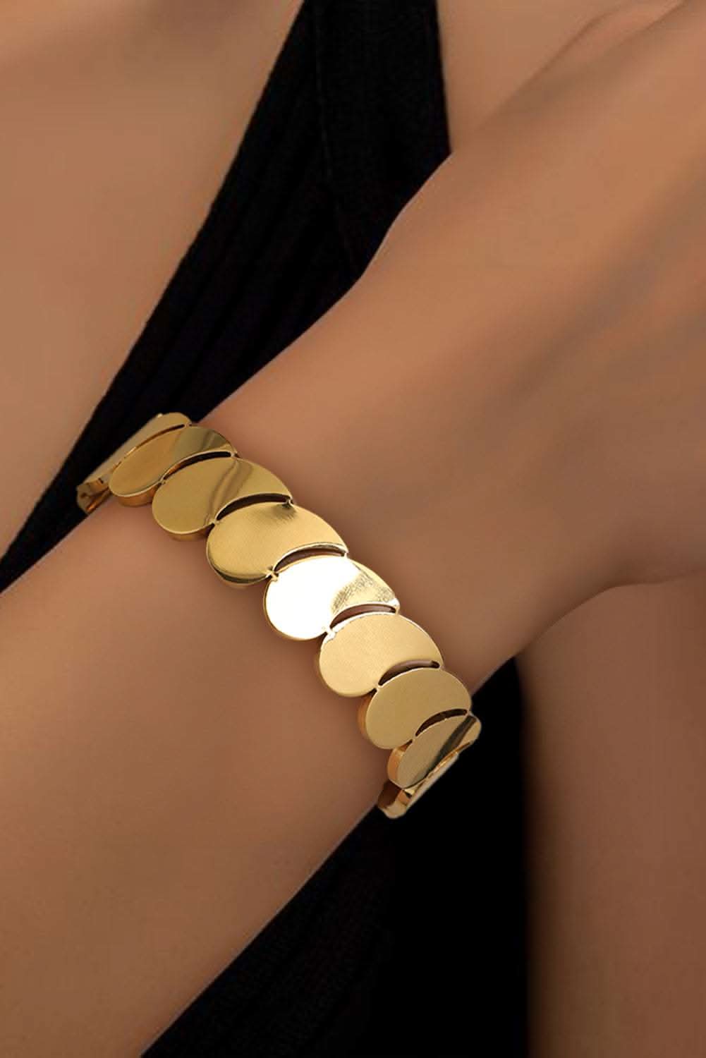 Gold Water Drop plated titanium steel bangle on wrist
