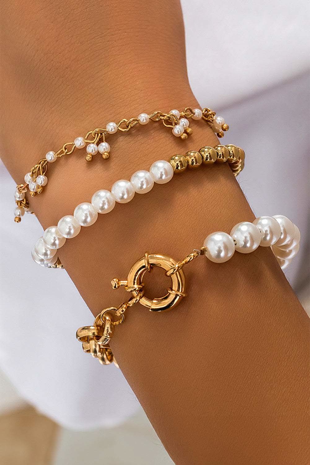 Gold 3pcs pearl plated alloy beaded bracelet set on wrist