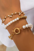 Gold 3pcs pearl plated alloy beaded bracelet set on wrist
