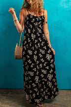 Black floral spaghetti strap maxi dress with shirred bodice and tied empire waist