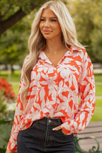 Woman wearing orange botanical print single chest pocket button up shirt outdoors