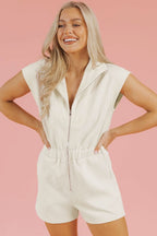 Jet Stream Textured white V neck collared romper with front zipper and cap sleeves.