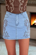 Beau Blue Western embroidered denim mini skirt with trendy western-inspired embroidery and durable fabric, perfect for casual and festival wear