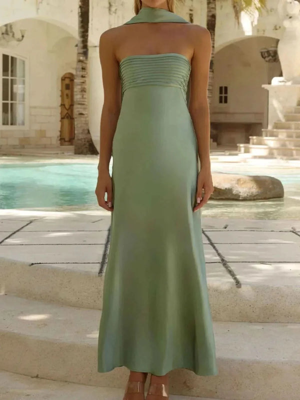 Sleeveless green Tube Mermaid Maxi Dress with fitted bodice and floor-length skirt by poolside